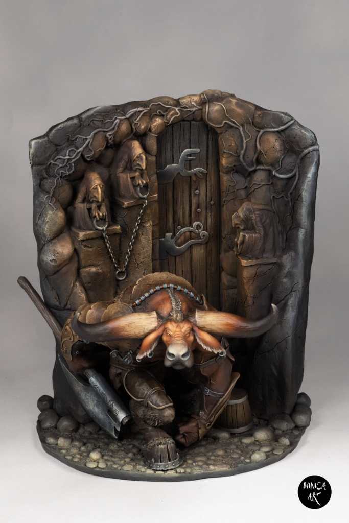 Detailed fantasy sculpture of a horned creature with weapons and skulls, medieval style.