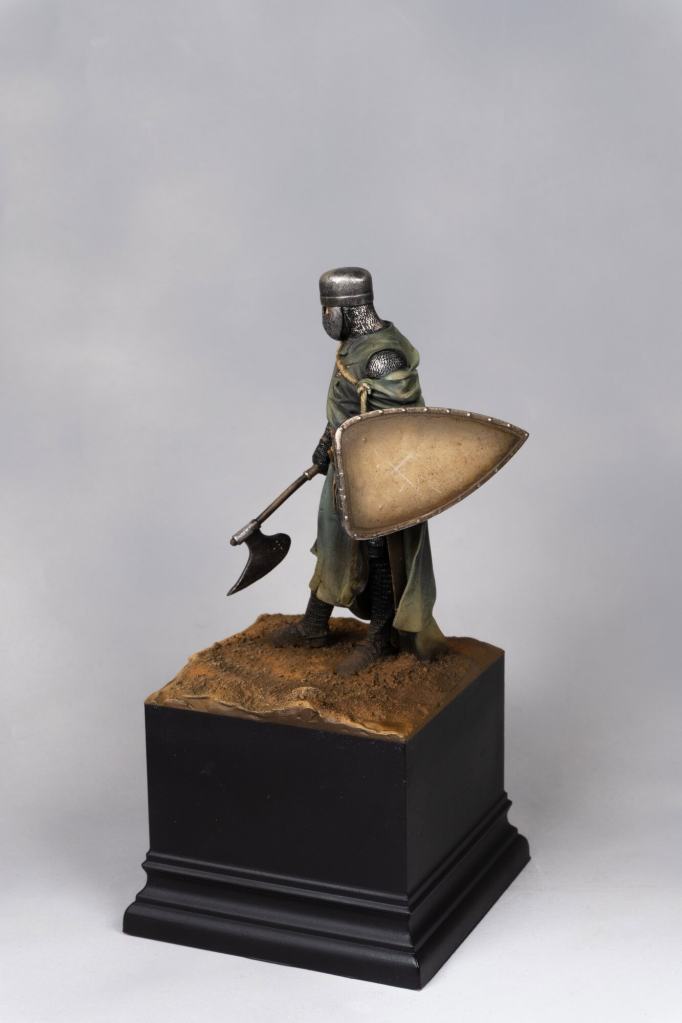 Detailed miniature of a medieval knight Hospitaller with shield and axe.
